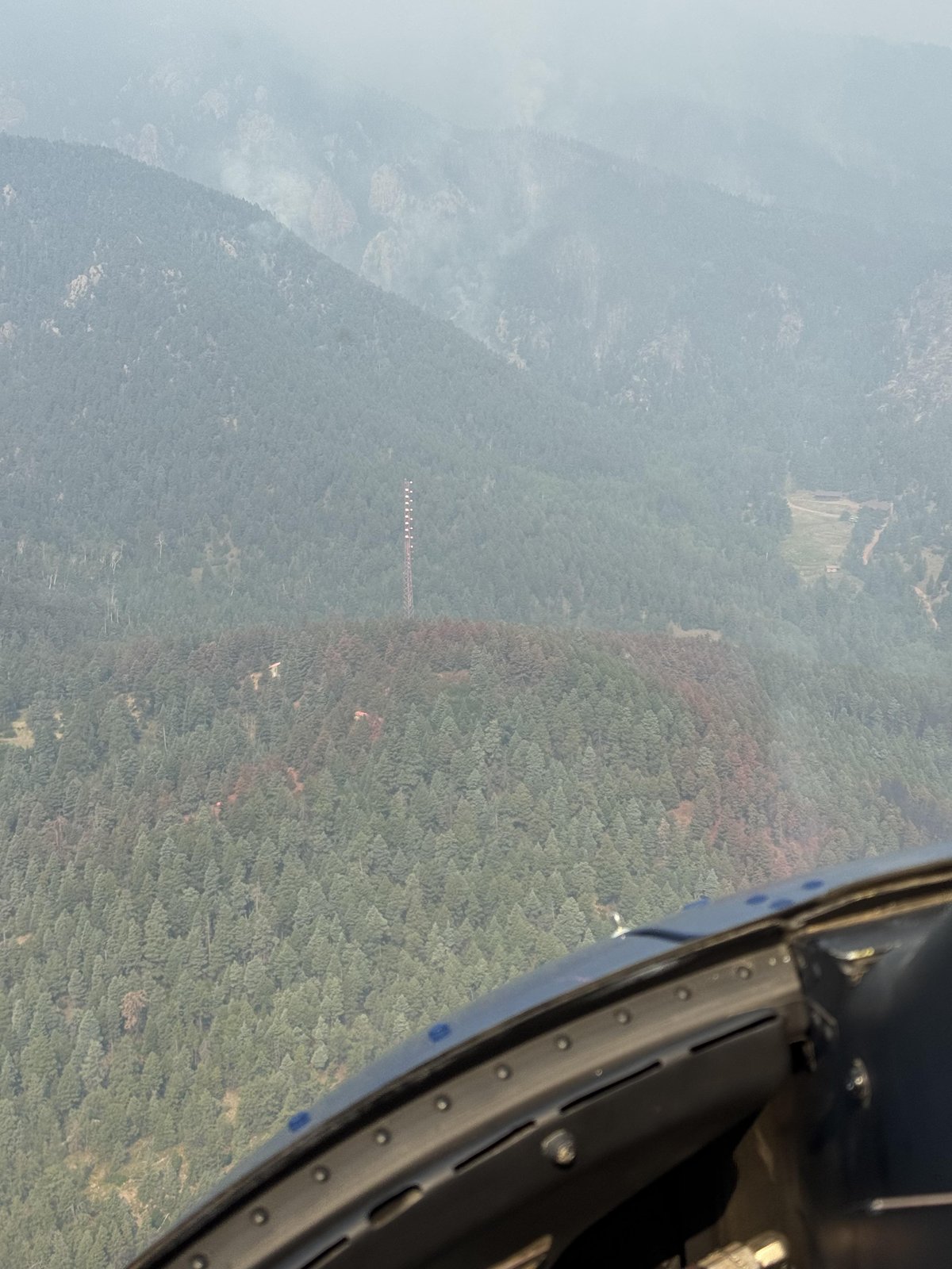 Communications site covered in retardant above Camp Jackson