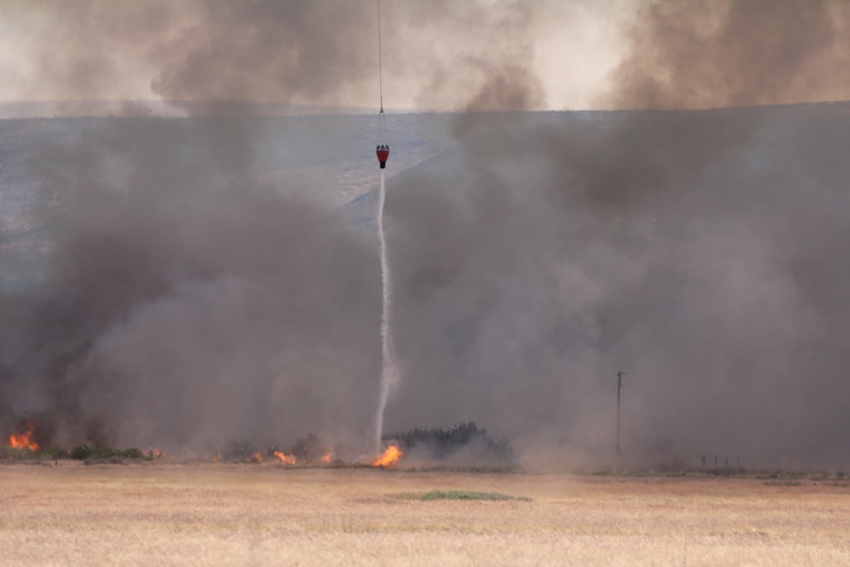 Helicopter Bucket Dropping Water
