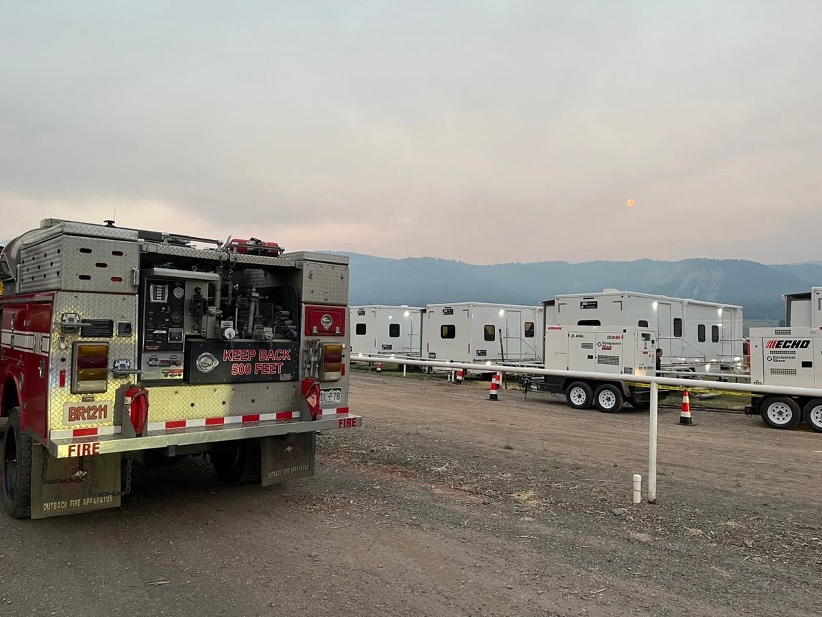 Engine headed out to fireline from a smokey Incident Ca...