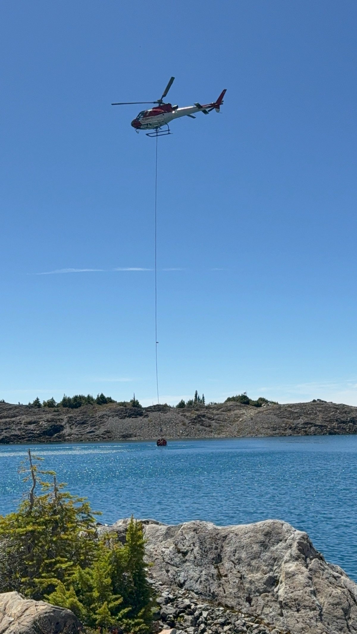 Helicopter Dip from Alpine Lake
