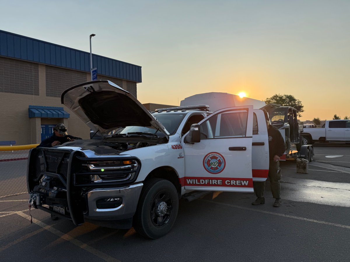 Firefighters Inspect Their Vehicle and Prepare for Anot...