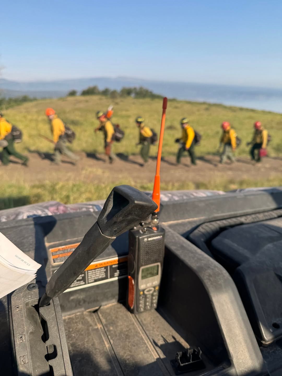 Crews walking along indirect fire line July 15,2026
