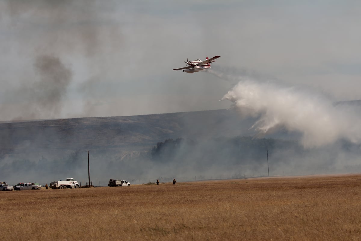 Scooper dropping water on the 4710 Tule Rd Fire.