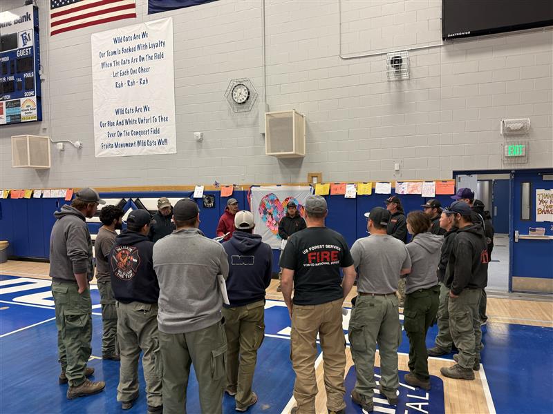 Firefighters Receive Instructions During a Division Bre...