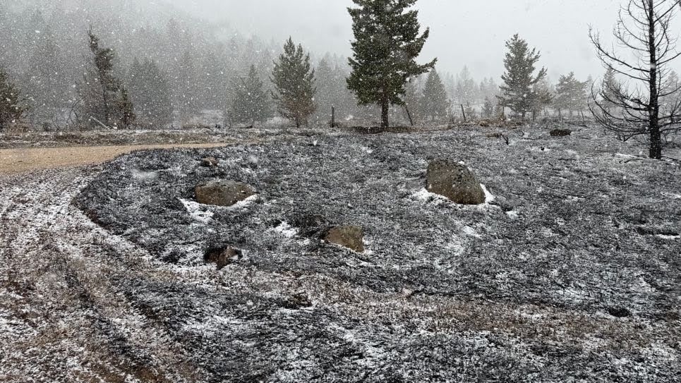 Snow falling on the East Side Fire