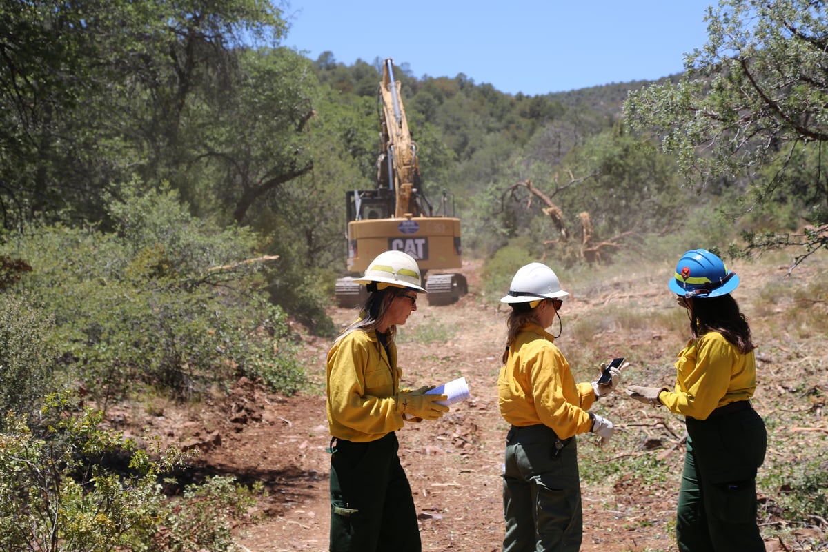 Resource advisors working with heavy equipment
