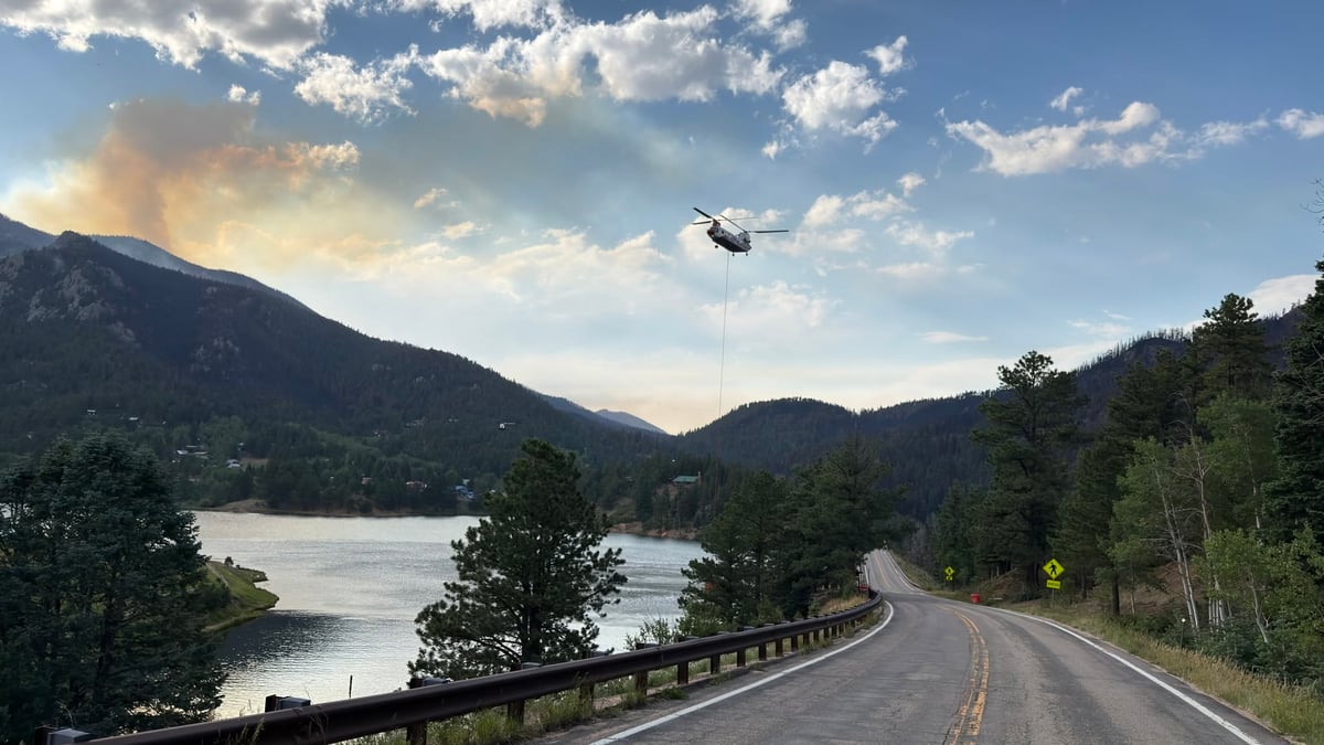 Helicopter getting water from lake