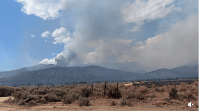 Iron Fire 2026 - Smoke plume rising above large wildfir...
