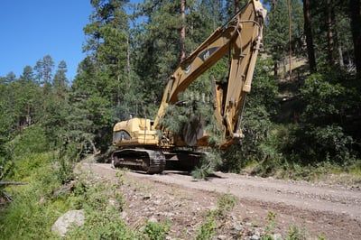 Excavator Clearing Debris on Sacaton Fire