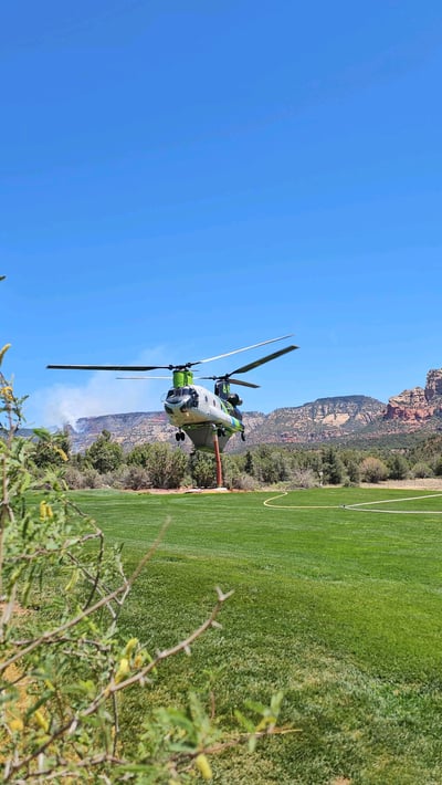 Helicopter Dips Water