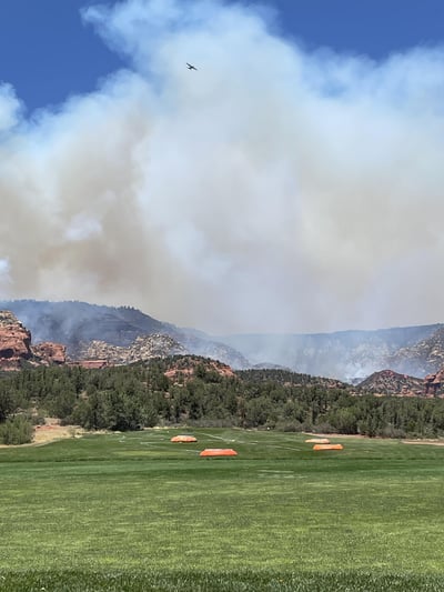 A Large Air Tanker Works in the Smoke