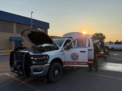 Firefighters Inspect Their Vehicle and Prepare for Anot...