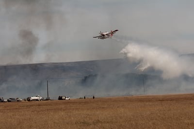 Scooper dropping water on the 4710 Tule Rd Fire.