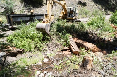 Sacaton Fire: Excavator clearing slash at Willow Creek