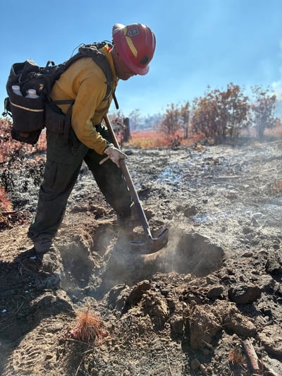 Digging line to help stop the Ferris Fire