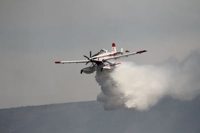 Scooper Dropping Water